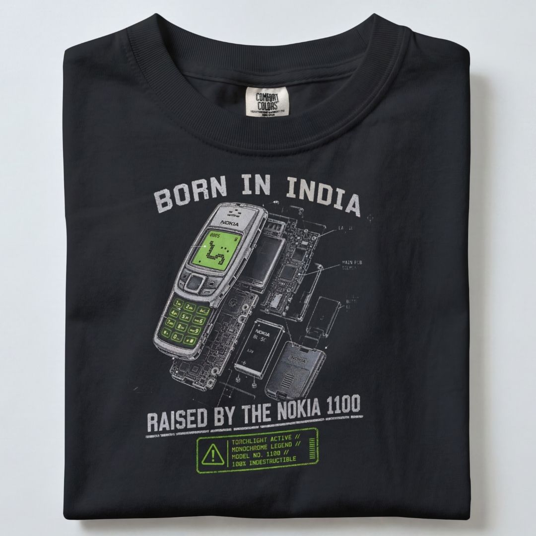 BORN IN INDIA RAISED BY THE NOKIA 1100 UNISEX TSHIRT