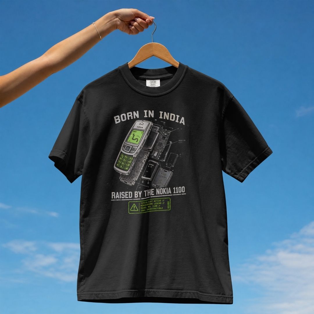 BORN IN INDIA RAISED BY THE NOKIA 1100 UNISEX TSHIRT