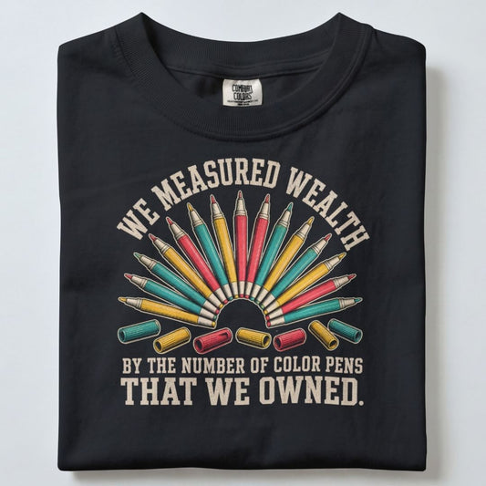 WE MEASURED WEALTH UNISEX TSHIRT